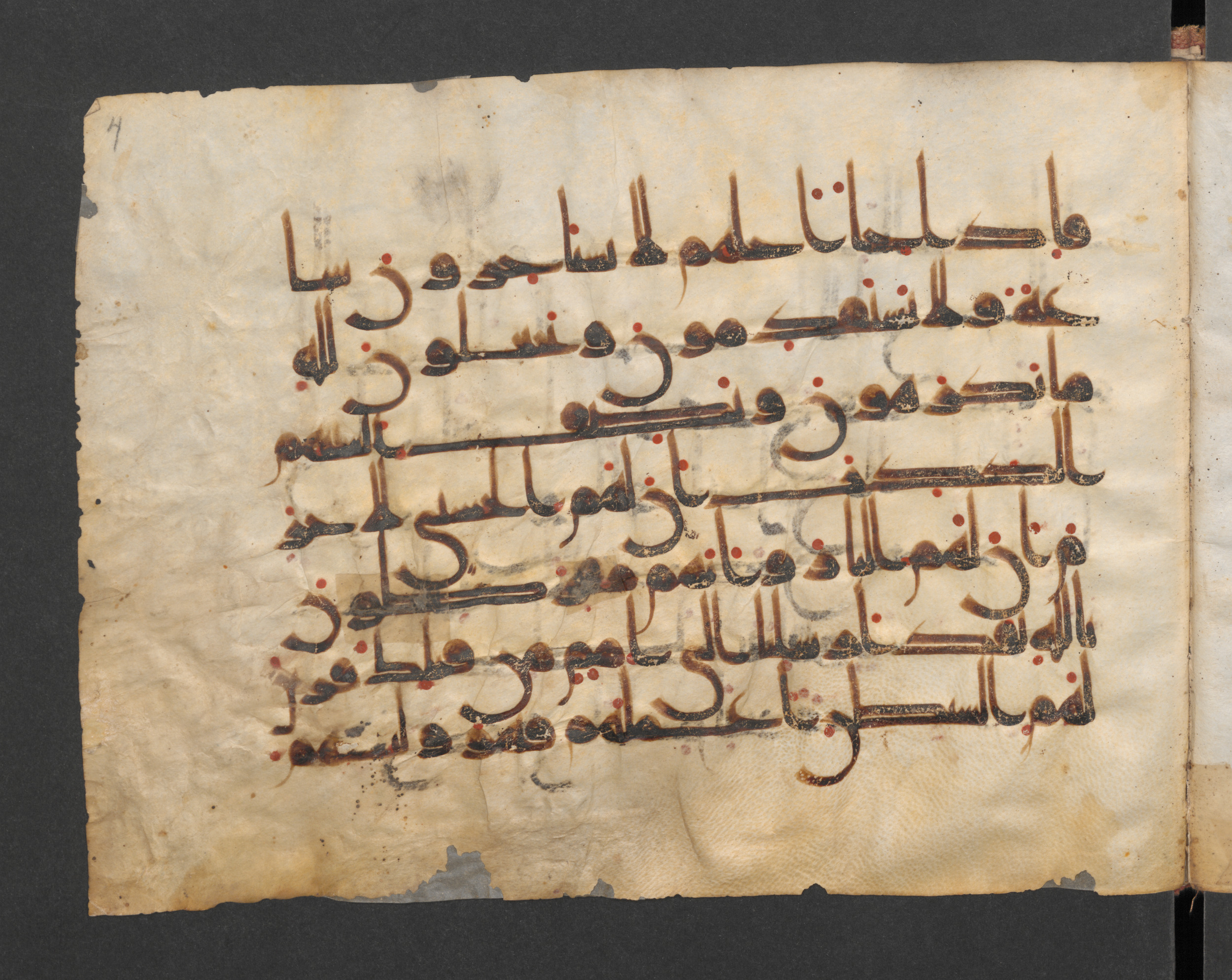 Berlin, Staatsbibliothek, Wetzstein II 1918 (Scan 1), in kūfī D, kūfī F.I script, showing Surah 16:63 from Mid 8th to Late 9th Century AD found in Damascus, Syria, currently housed at Staatsbibliothek zu Berlin, Berlin, Germany