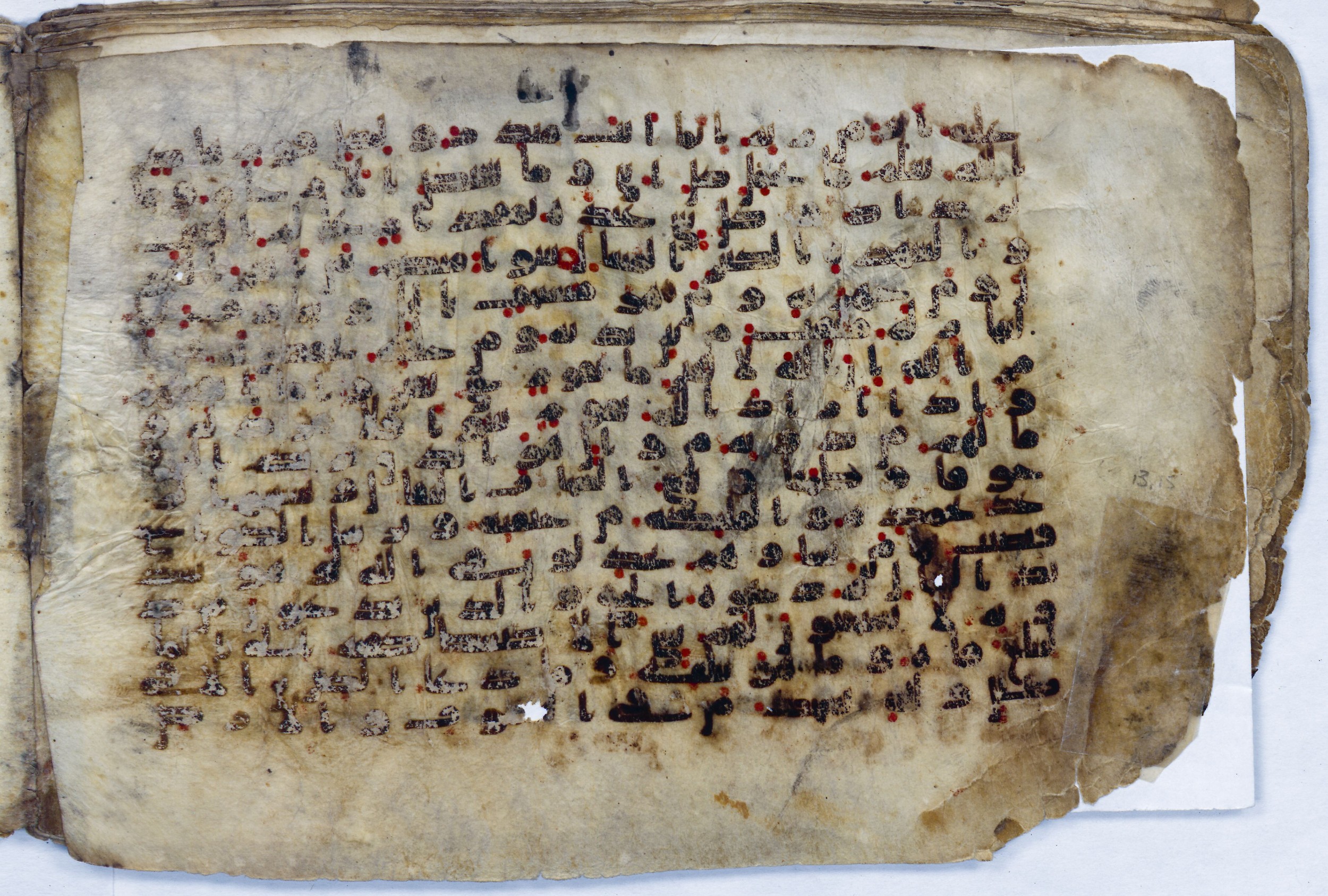 Leiden, Universiteitsbibliotheek Leiden, Or. 6814, in kūfī B.II script, showing Surah 13:13 from 8th to 9th Century AD found in Unknown (Purchased in Oegstgeest, Netherlands), currently housed at Universiteitsbibliotheek Leiden, Leiden