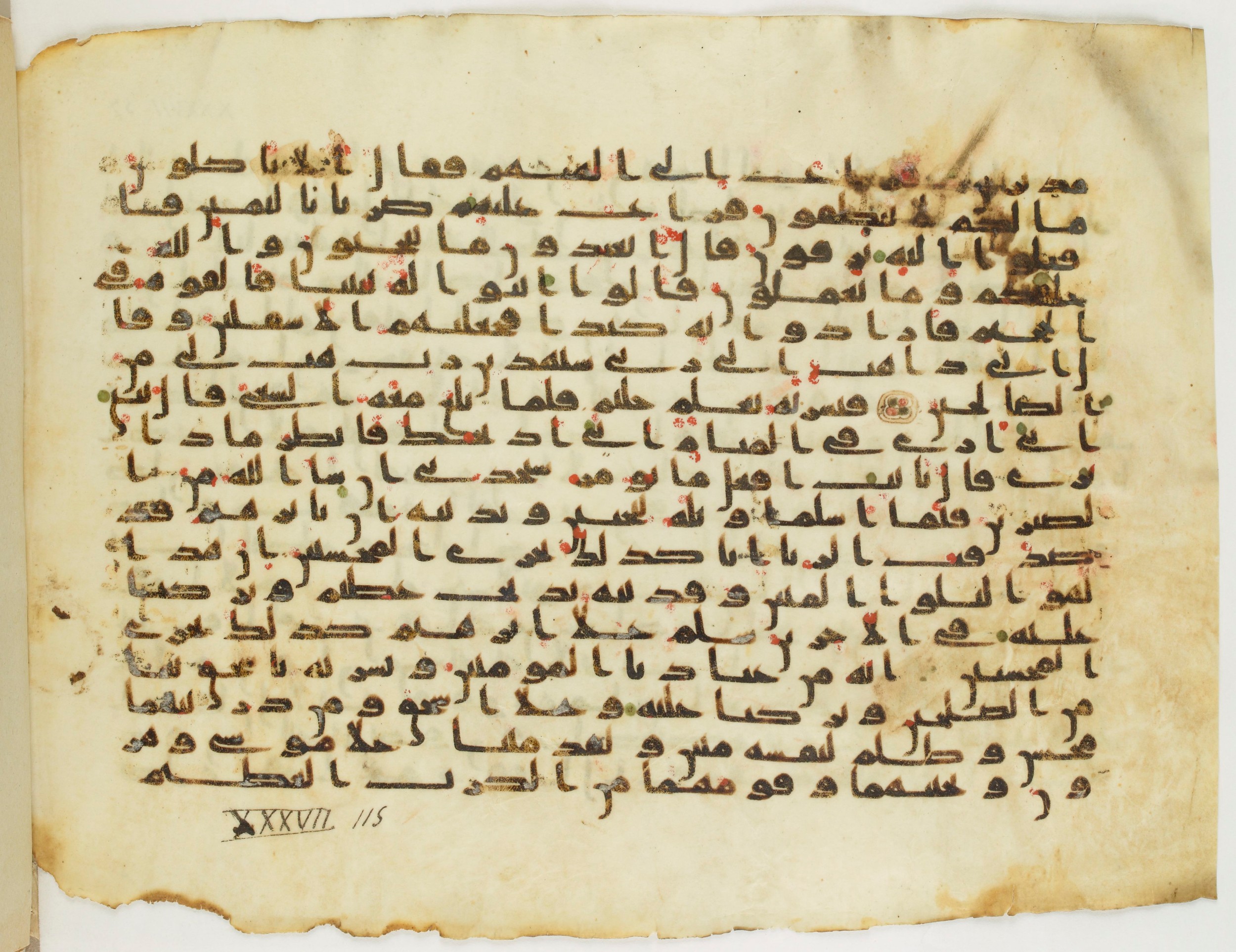 BnF Arabe 333 (d), in Early Kufic (C.III) script, showing Surah 37:113 from Late 8th to 9th Century AD found in Fustat (Old Cairo), Egypt, currently housed at Bibliothèque nationale de France, Paris