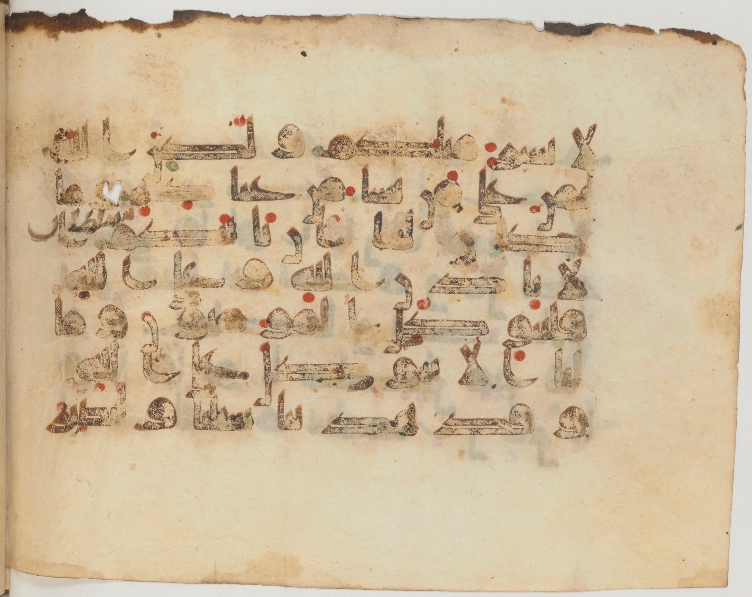 Arabe 359 (c) (Scan 1), in Kufic Group D script, showing Surah 14:12 from Mid-8th to 10th Century AD found in al-Fusṭāṭ (Fustat), Egypt, currently housed at Bibliothèque nationale de France, Paris