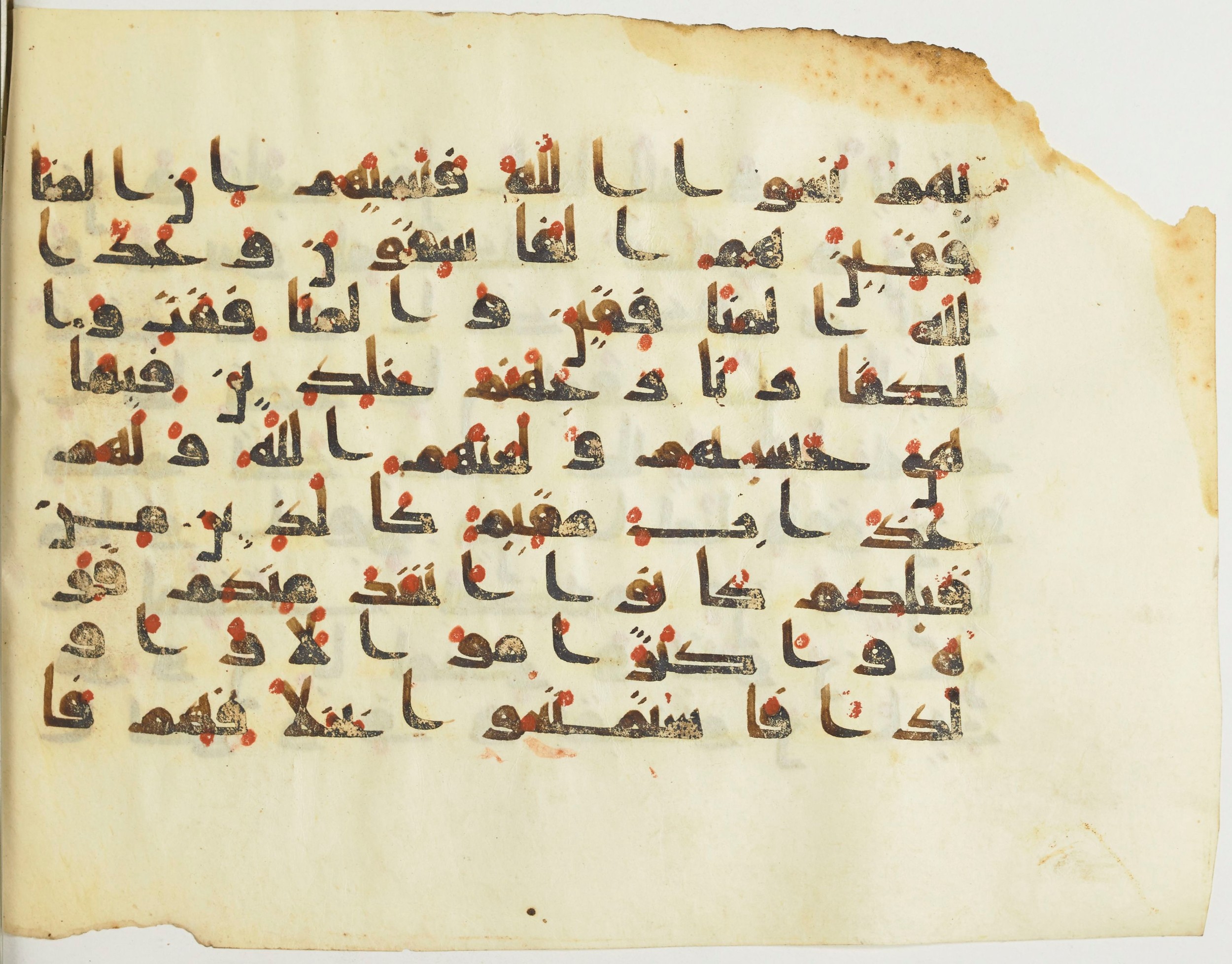 BnF Arabe 376 (a) (Scan 1), in Kufic D.I script, showing Surah 9:69 from Mid 8th to Late 9th Century AD found in Fustat (Old Cairo), Egypt, currently housed at Bibliothèque nationale de France, Paris