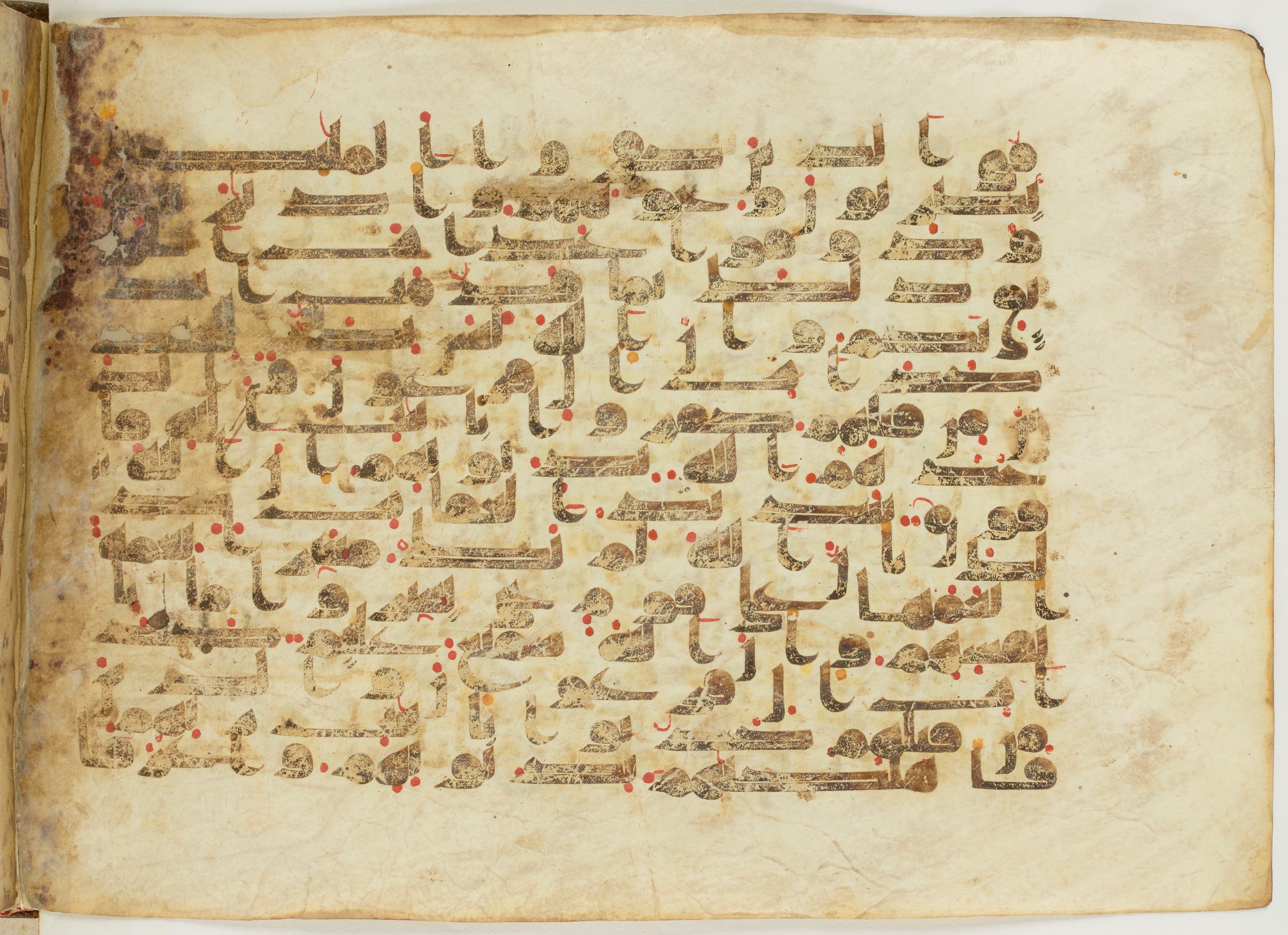 Paris, Bibliothèque nationale de France, Arabe 6982, in Kufic B.II script, showing Surah 8:52 from Mid 8th to Late 9th Century AD found in Unknown (formerly in the Lyautey collection), currently housed at Bibliothèque nationale de France, Paris