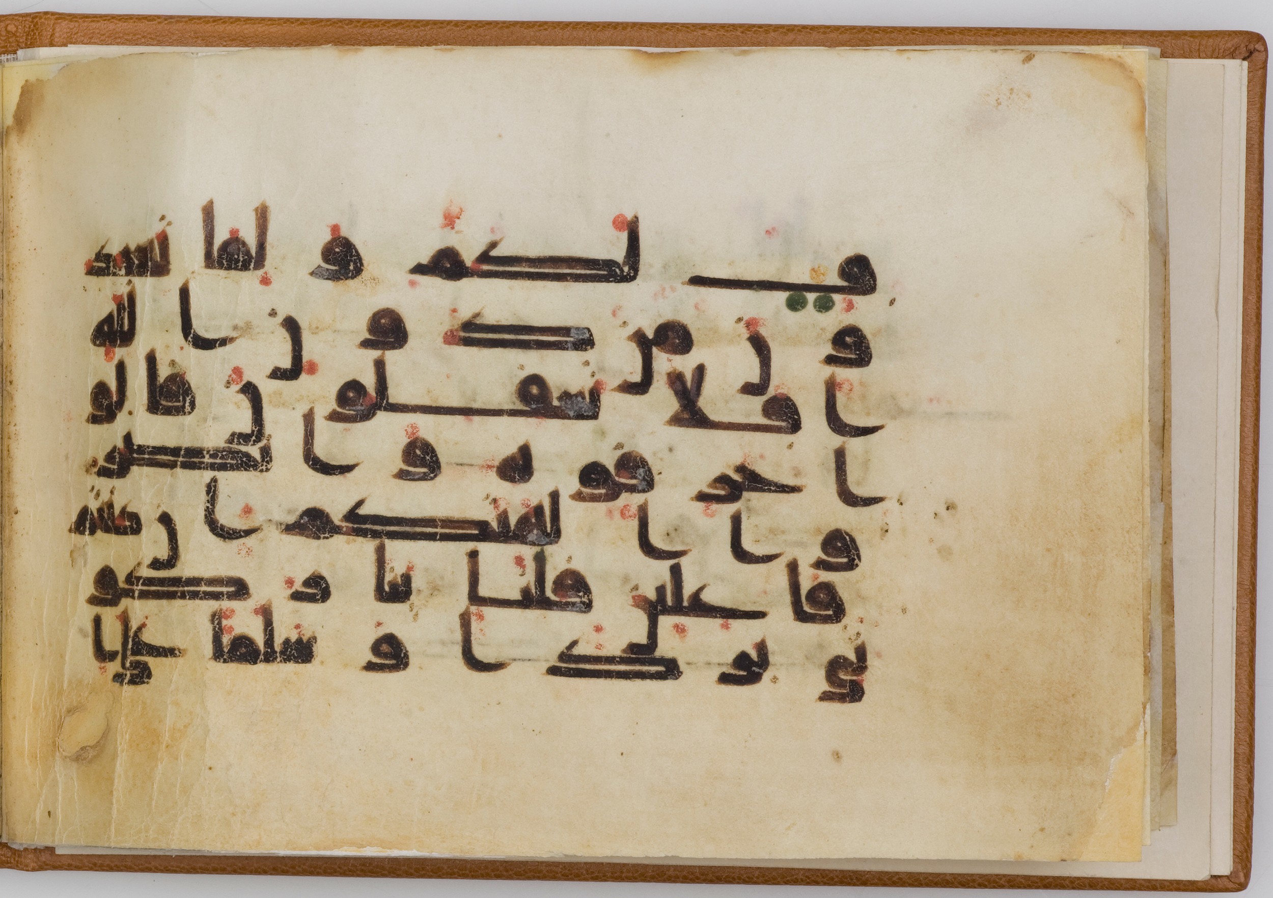 London, The Khalili Collections, QUR 49 (Scan 1), in kūfī D.Va script, showing Surah 21:67 from Late 9th / Early 10th Century AD found in Unknown, currently housed at The Khalili Collections, London