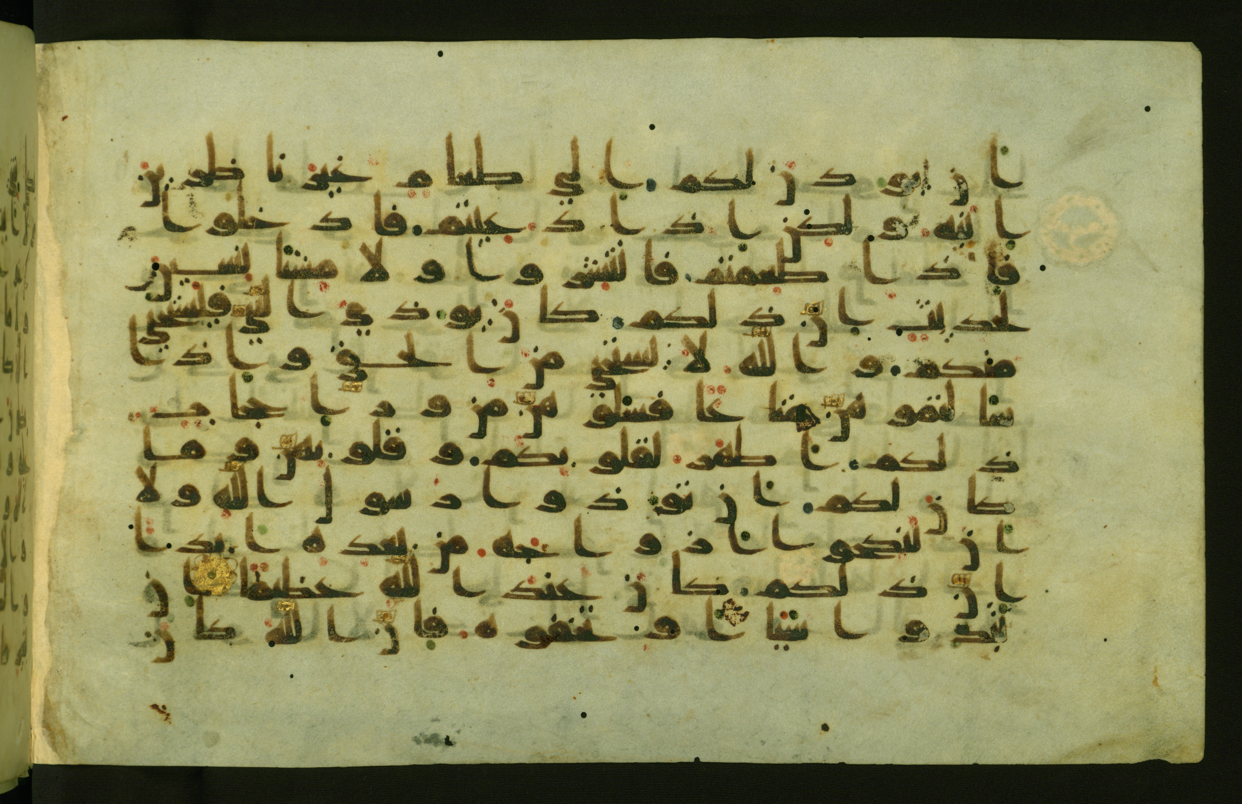 Walters W.554 (Scan 1), in Early Abbasid (Kufic) script, showing Surah 33:54 from Late 9th Century AD found in Egypt, currently housed at The Walters Art Museum, Baltimore, Maryland
