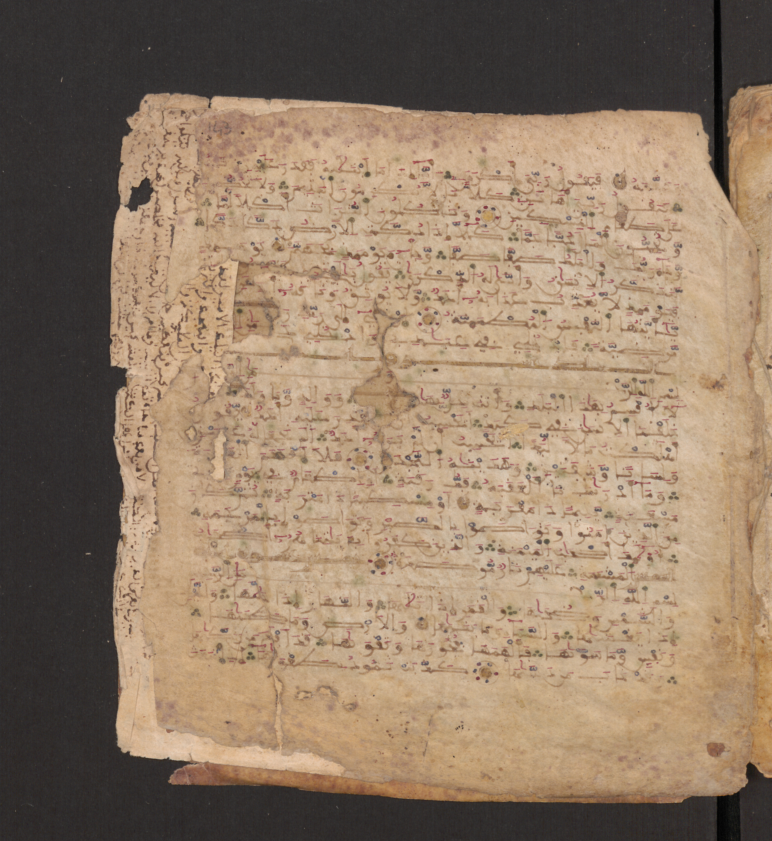 Doha, Qatar National Library, HC.MS.00715, in Maġribī micrography script, showing Surah 91:2 from 11th to 12th Century AD found in Muslim Iberia (al-Andalus), currently housed at Qatar National Library, Doha
