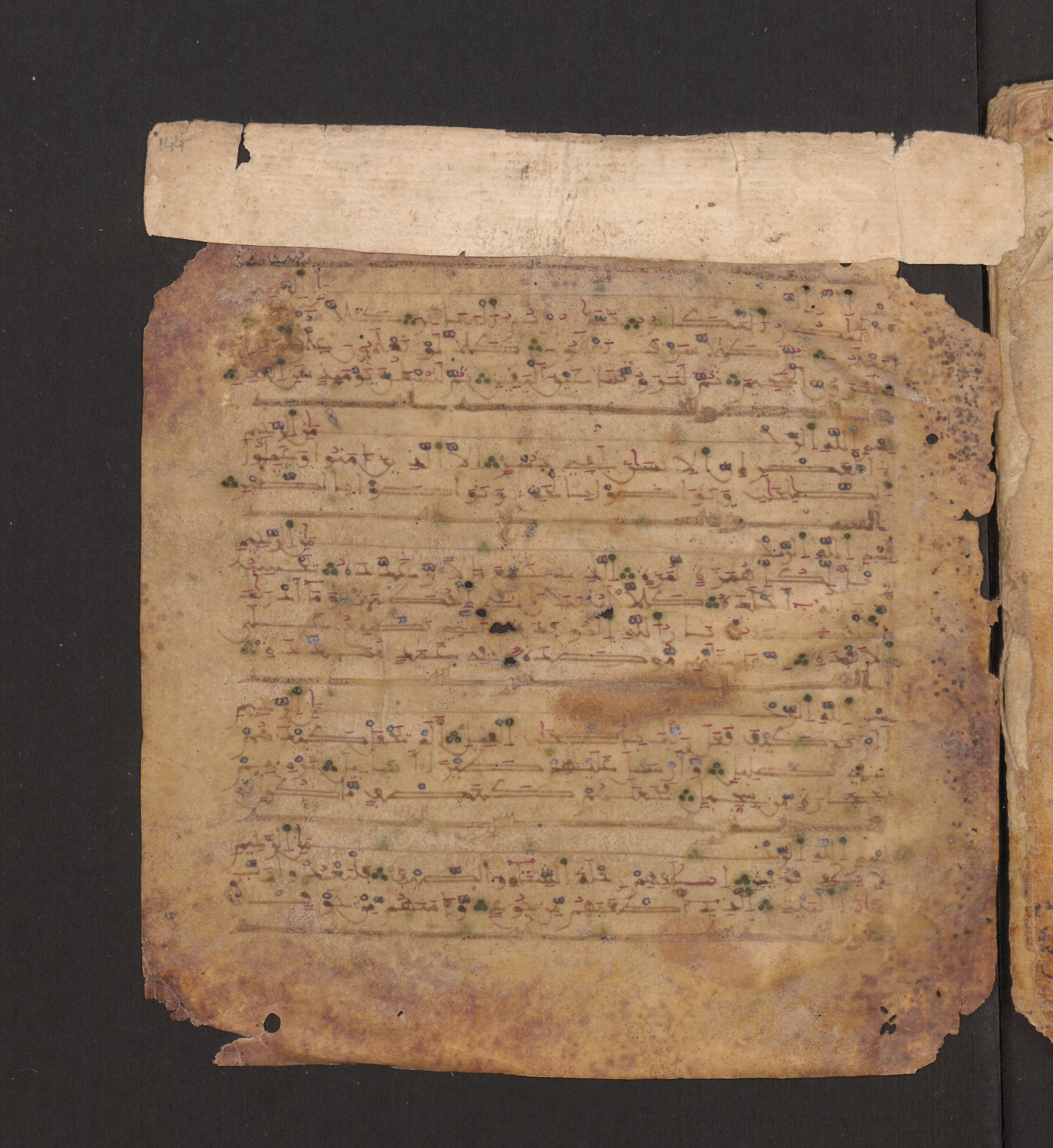 Doha, Qatar National Library, HC.MS.00715, in Maġribī micrography script, showing Surah 104:2 from 11th to 12th Century AD found in Muslim Iberia (al-Andalus), currently housed at Qatar National Library, Doha