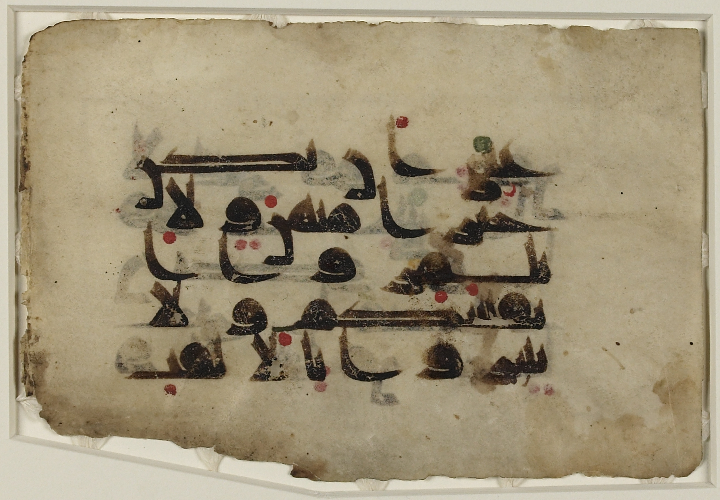Doha, Qatar National Library (مكتبة قطرالوطنية), HC.MS.2017.0045 (Scan 2), in kūfī D.III script, showing Surah 49:11 from Mid 8th to Late 9th Century AD found in Unknown, currently housed at Qatar National Library, Doha