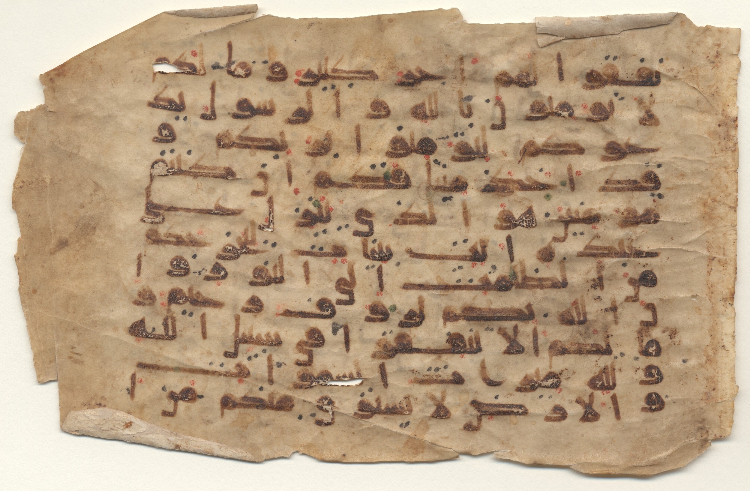Providence, Rhode Island, Brown University Library, 6128, in kūfī E.I script, showing Surah 57:7 from Late 8th to 9th Century AD found in Unknown, currently housed at Brown University Library, Providence, Rhode Island, USA