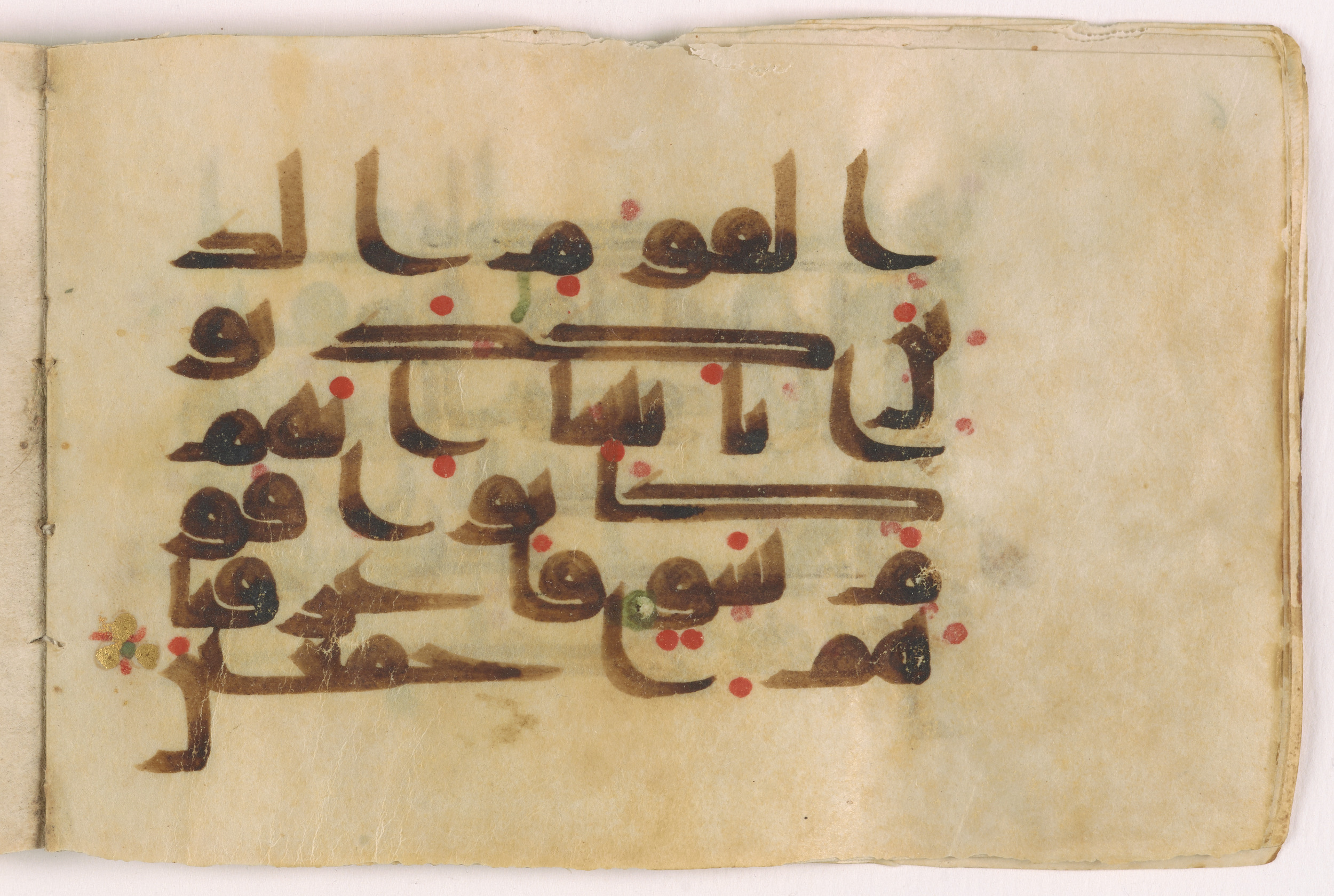 Doha, Qatar National Library, HC.MS.03160 (Scan 2), in Kūfī D script, showing Surah 21:77 from Mid 8th to Late 9th Century AD found in Unknown, currently housed at Qatar National Library, Doha